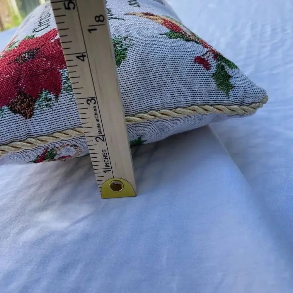 Small tapestry Christmas pillow Poinsettia graphic
